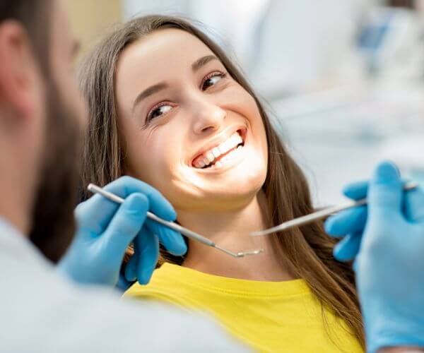 Employee using benefits for dental visit