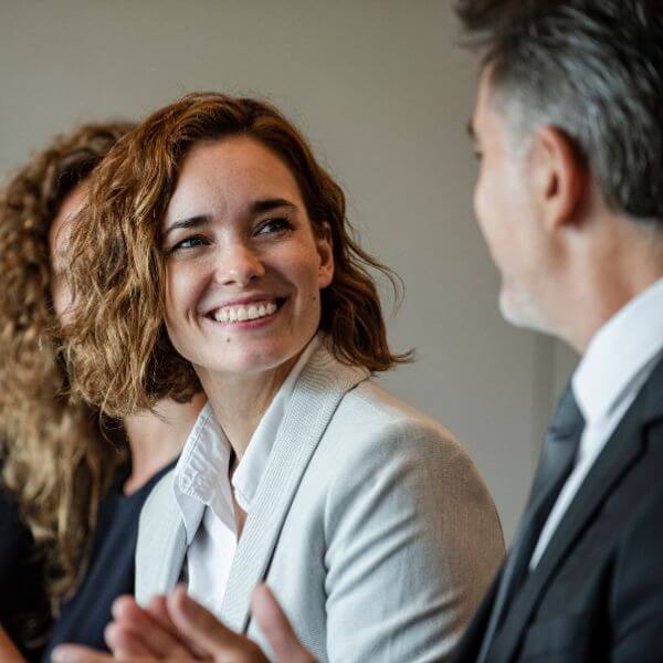 Employee smiling during HR meeting