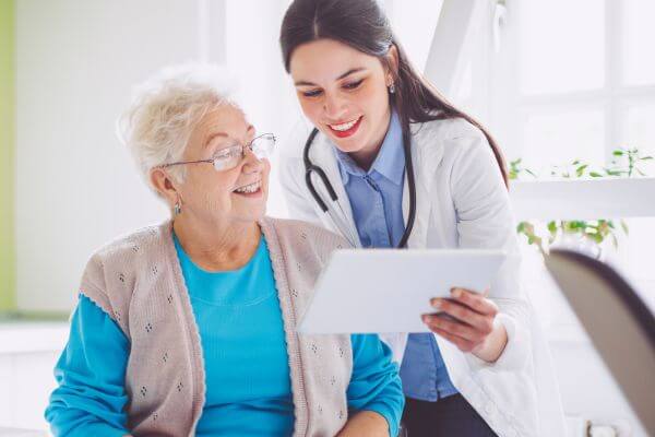 employee_medical_plan_consultation Woman looking at her health insurance plan