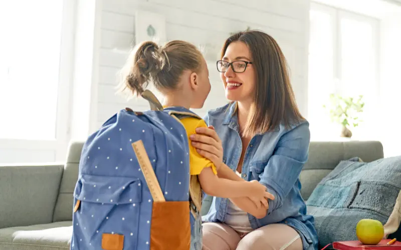 Mother sending her child off to school