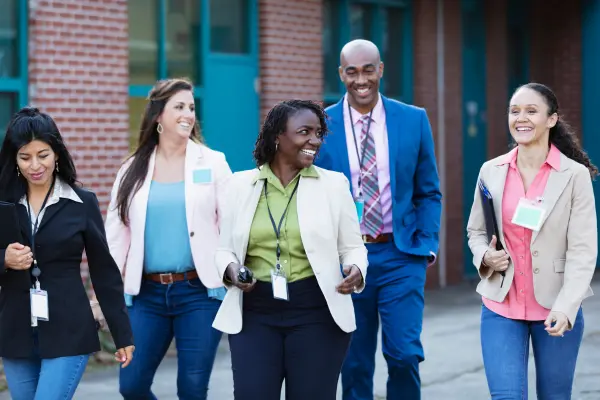 School administrators walking discussing HR