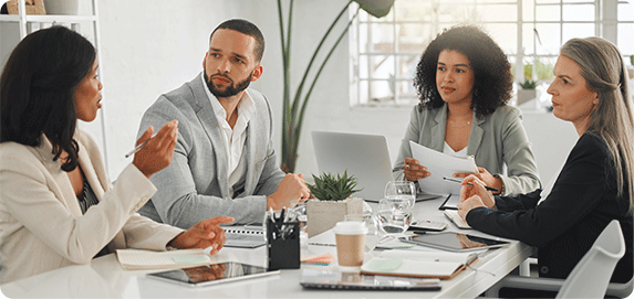 Business owner reviewing EEOC compliance and pay transparency policy updates